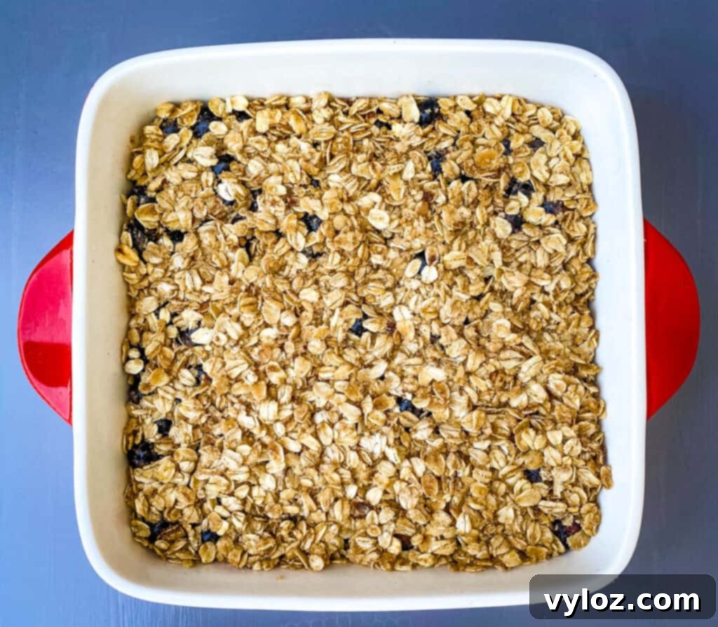unbaked healthy blueberry crisp in a baking dish