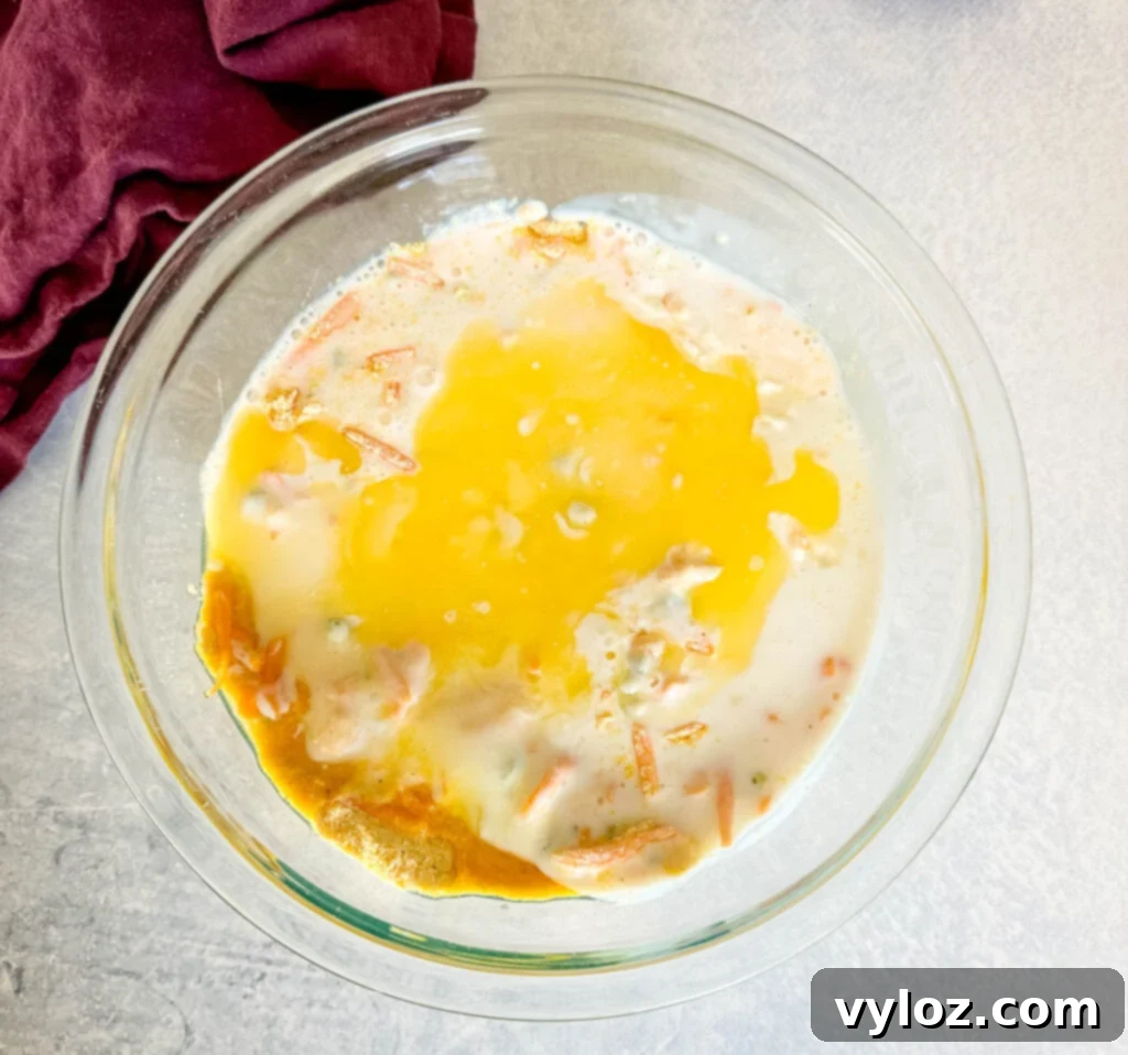 Zesty Cheddar Jalapeño Cornbread 5 cornmeal, cheddar cheese, jalapenos, baking powder, buttermilk, and flour in a glass bowl