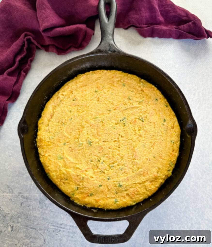 Zesty Cheddar Jalapeño Cornbread 7 jalapeno cornbread batter in a cast iron skillet