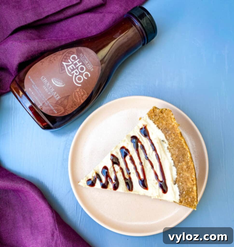 Low carb healthy peanut butter pie on a plate with chocolate syrup