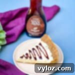 Low carb healthy peanut butter pie on a plate with chocolate syrup