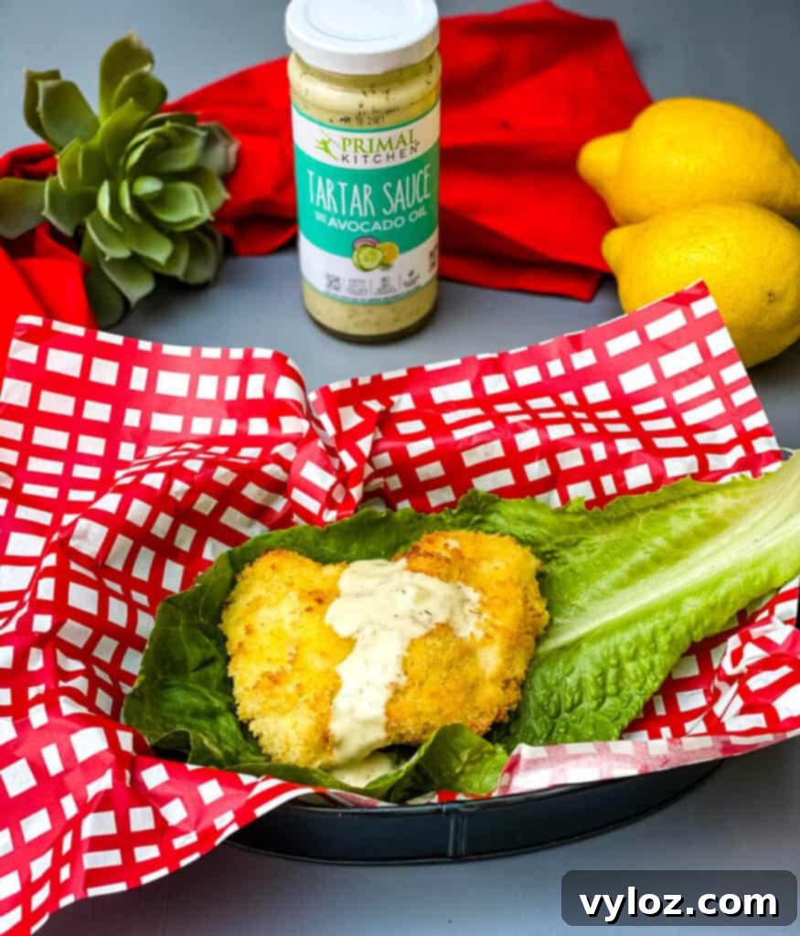 Crispy Air Fryer Fish Sandwich 9 Air fryer fish sandwich on a lettuce wrap with melted cheese and tartar sauce