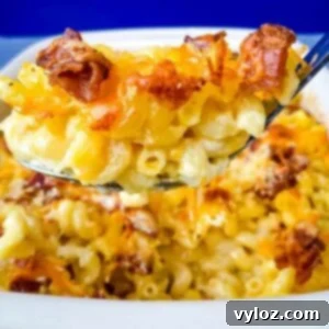 Ultimate Bacon Mac and Cheese 10 spoonful of bacon gouda mac and cheese over a baking pan