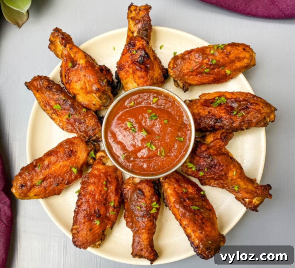 air fryer bbq chicken on a plate with bbq sauce