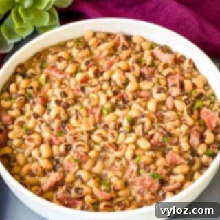 Instant Pot black eyed peas in a white bowl, featured in recipe card