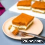 pumpkin cheesecake bars on a pink plate