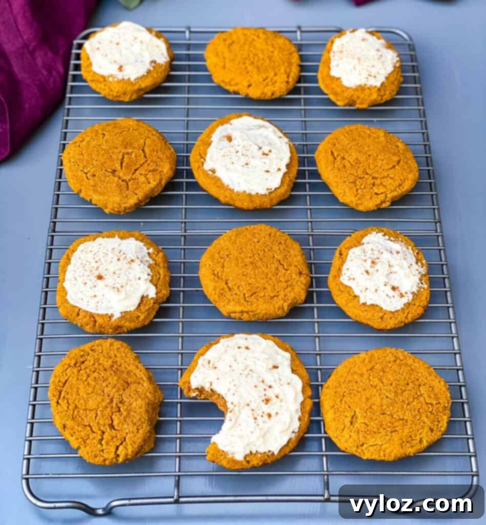 Guilt-Free Pumpkin Spice Cookies 13 keto pumpkin cookies with icing on a cooling rack