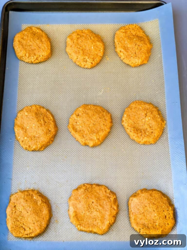 Guilt-Free Pumpkin Spice Cookies 8 baked keto pumpkin cookies on a cookie sheet