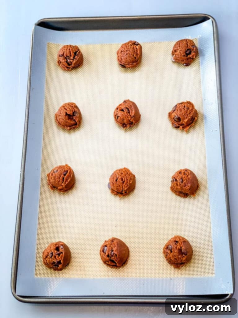 unbaked keto chocolate cookie dough on a cookie sheet