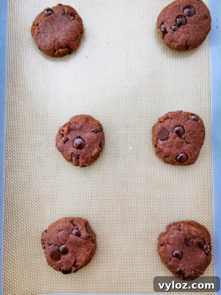 unbaked keto chocolate cookie dough on a cookie sheet