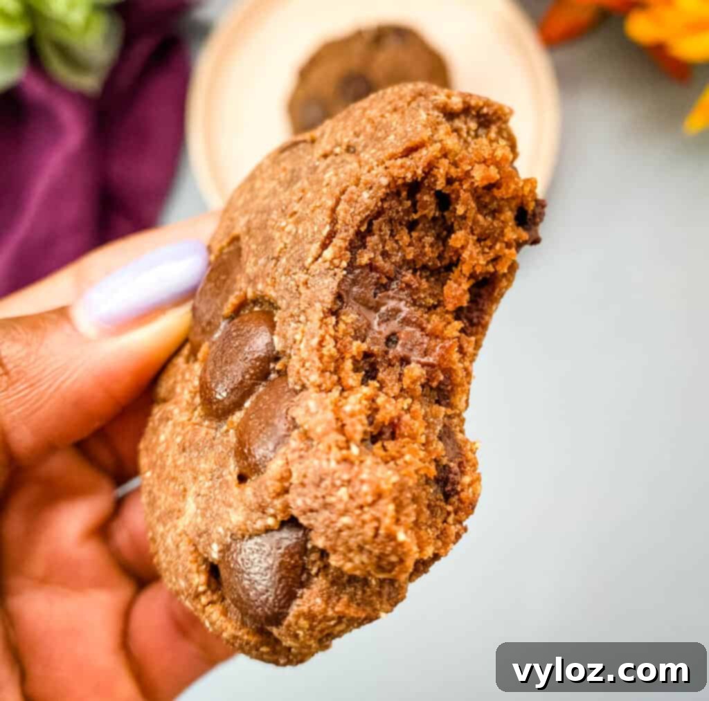 person holding keto double chocolate cookie
