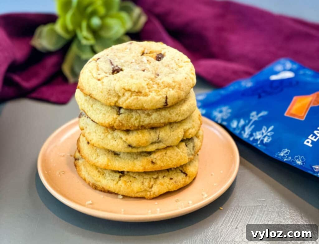 a stack of keto low carb peanut butter cup cookies on a pink plate