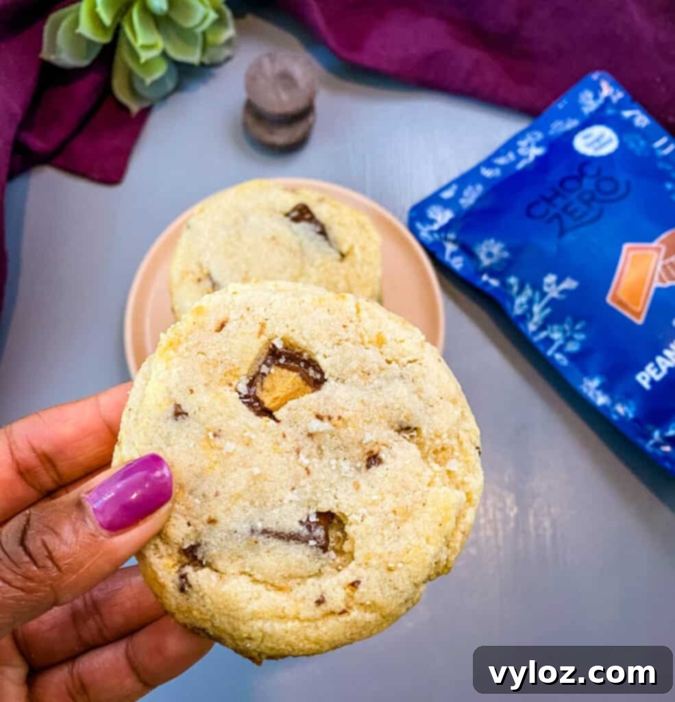person holding keto low carb peanut butter cup cookie
