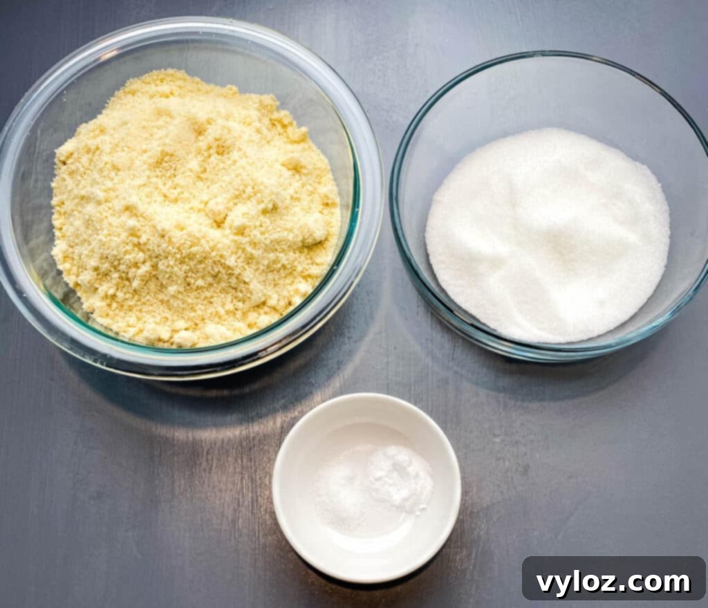 almond flour, sweetener, and baking soda in glass bowls on a flat surface