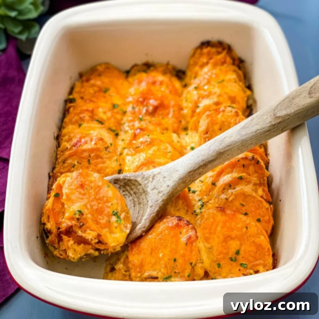 au gratin sweet potatoes in a red baking dish