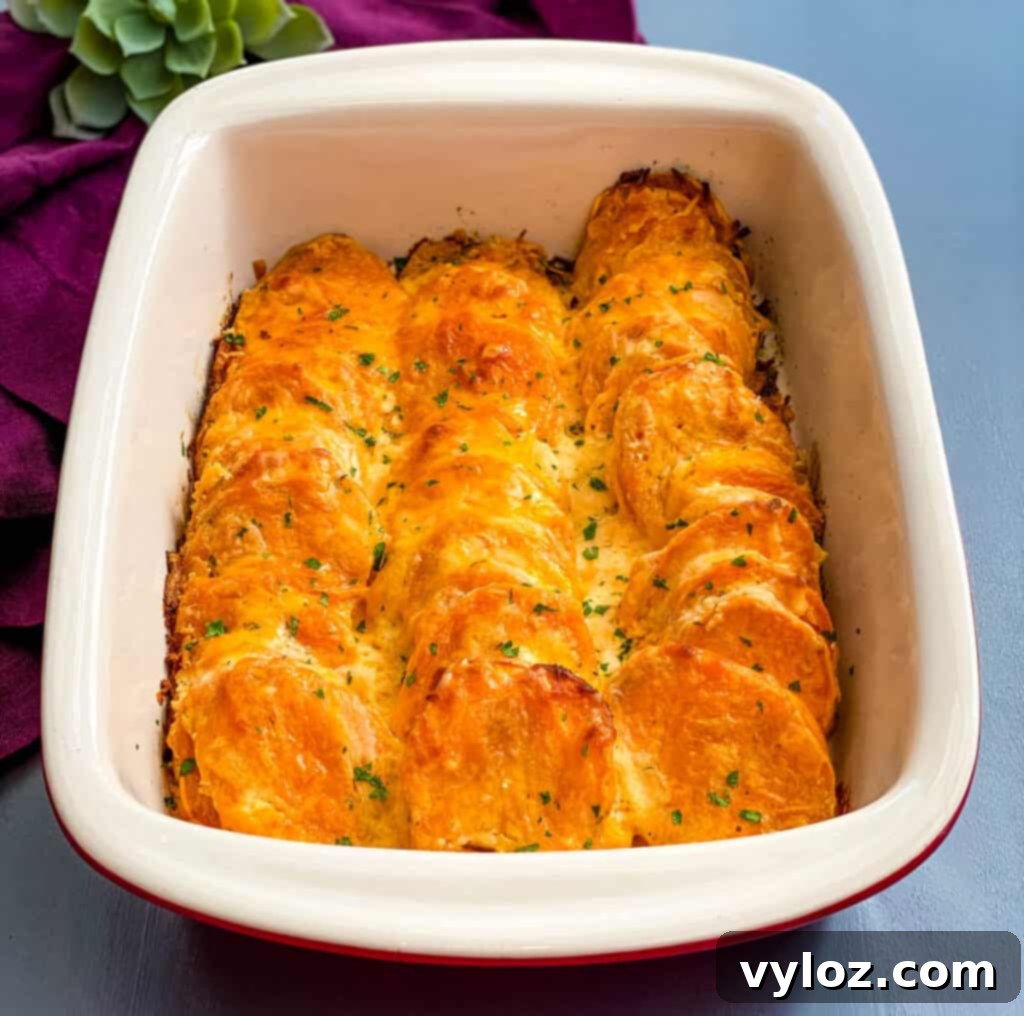 au gratin sweet potatoes in a red baking dish
