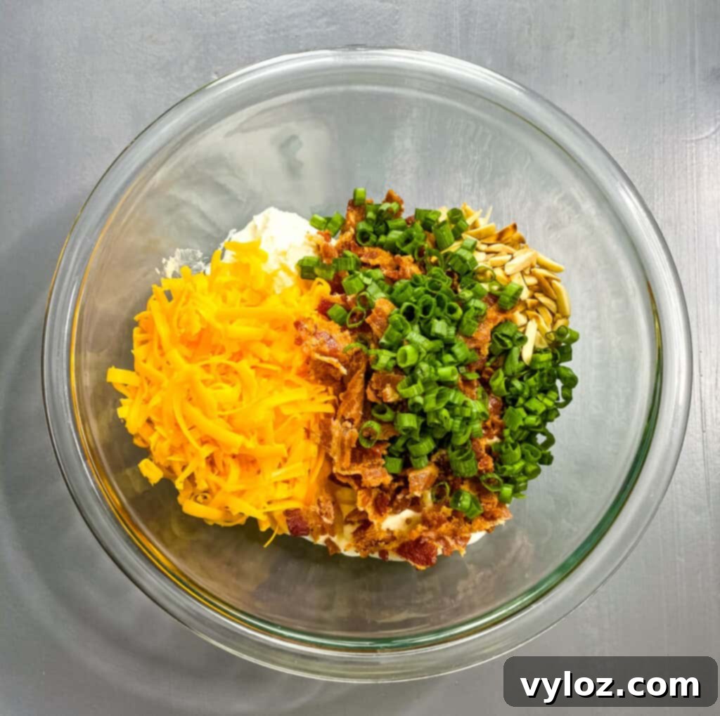 Million Dollar Dip in a elegant glass bowl, showcasing its creamy texture and visible ingredients.