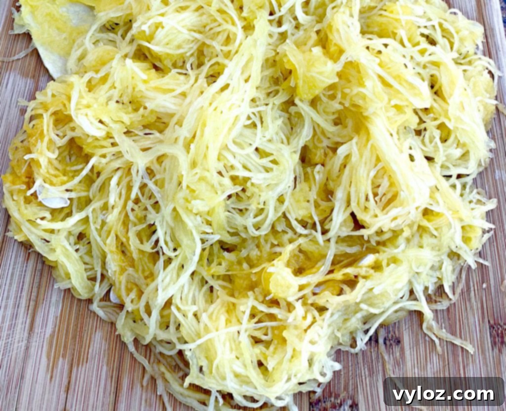 spaghetti squash strands on a bamboo cutting board