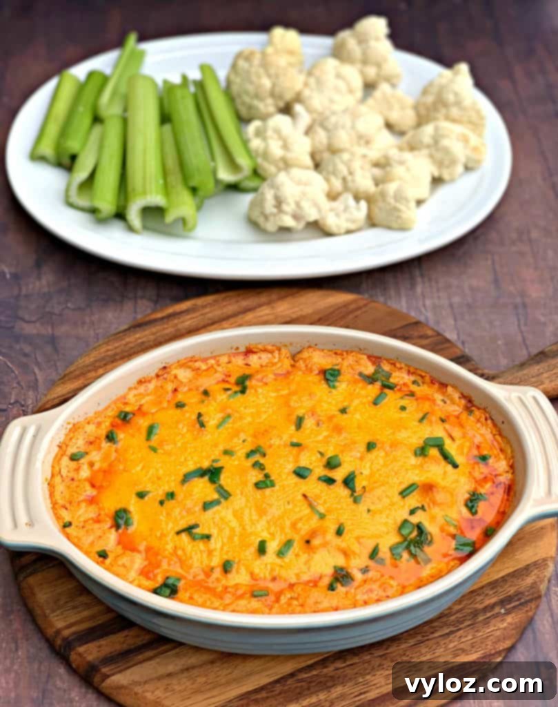 Close-up of keto low carb buffalo chicken dip in a baking dish, ready to be served.
