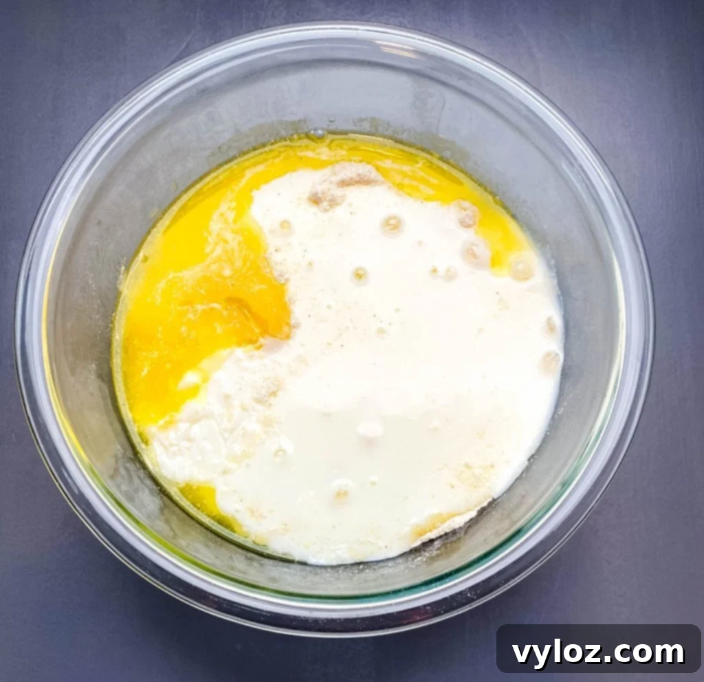 honey cornbread batter in a glass bowl
