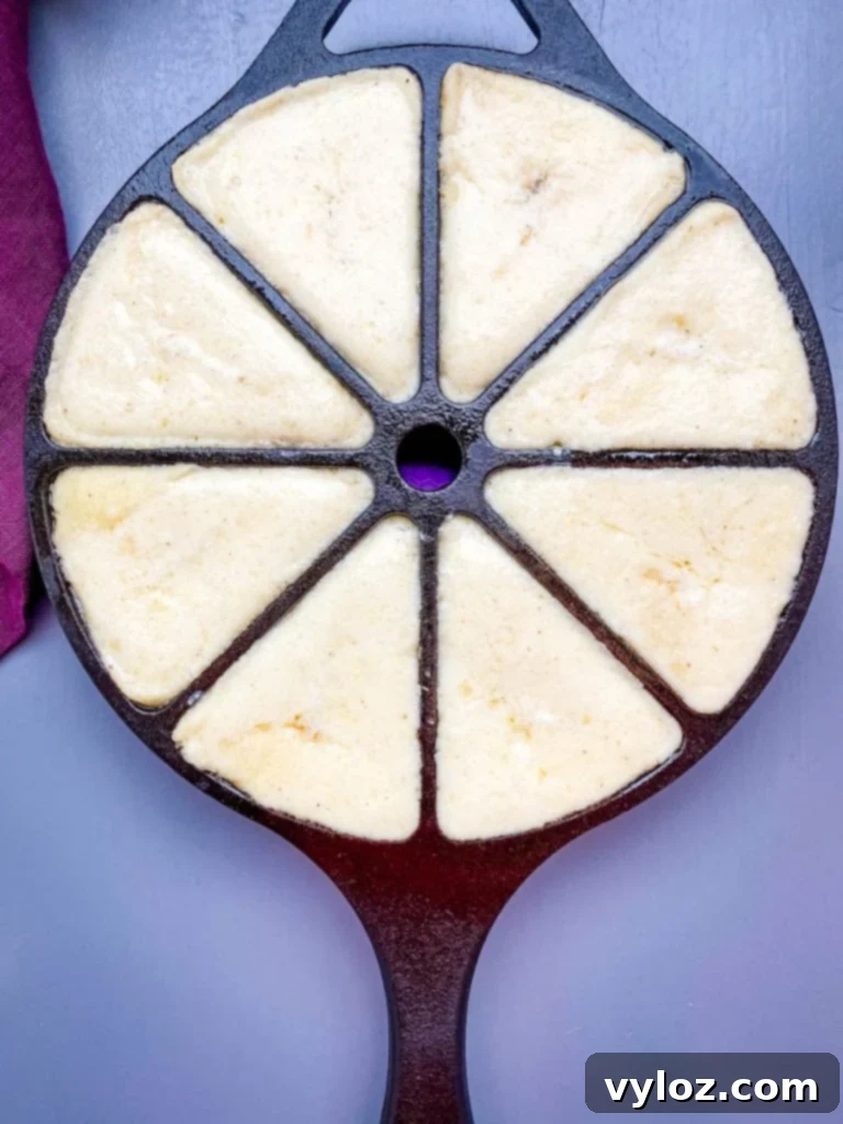 honey butter cornbread batter in a cast iron skillet