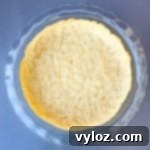 keto pie crust baked in a glass pie plate pan