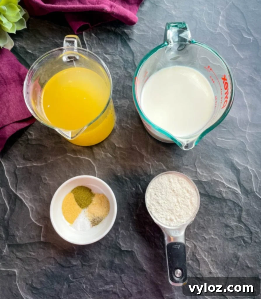 Arrangement of chicken broth, fresh milk, all-purpose flour, and a selection of seasonings on a flat kitchen surface, ready for soup preparation.