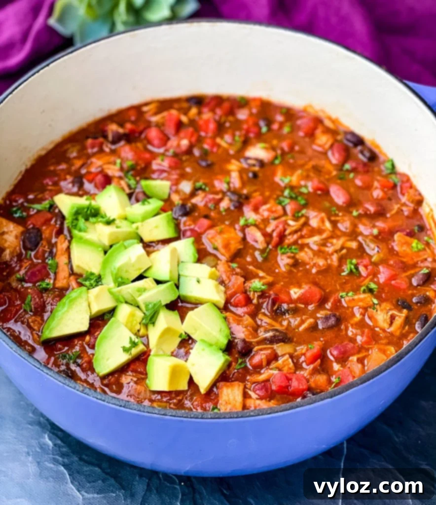 leftover turkey chili in a purple Dutch oven
