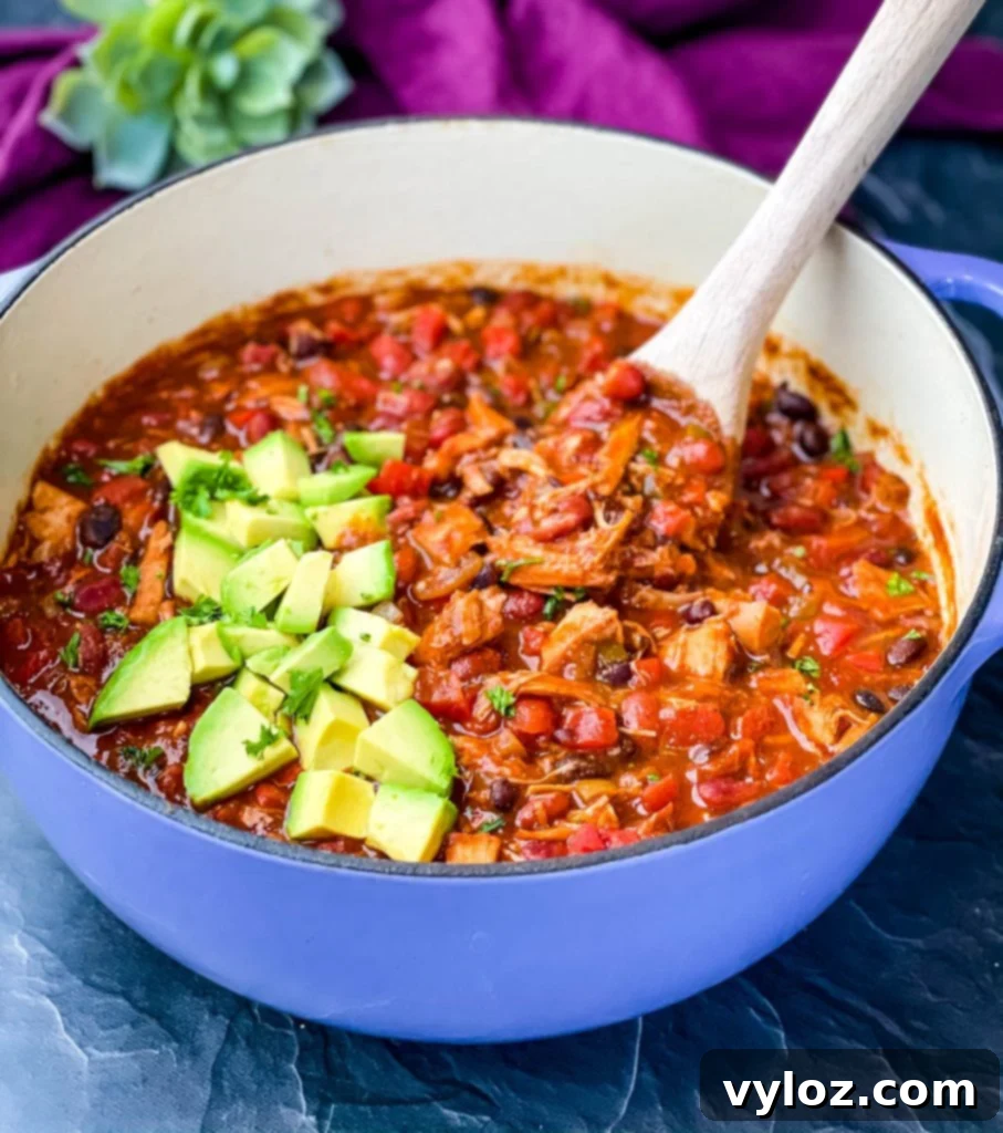 leftover turkey chili in a purple Dutch oven