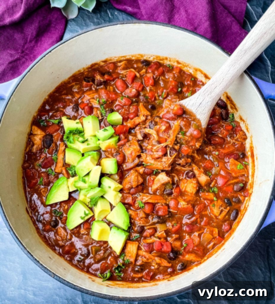 leftover turkey chili in a purple Dutch oven