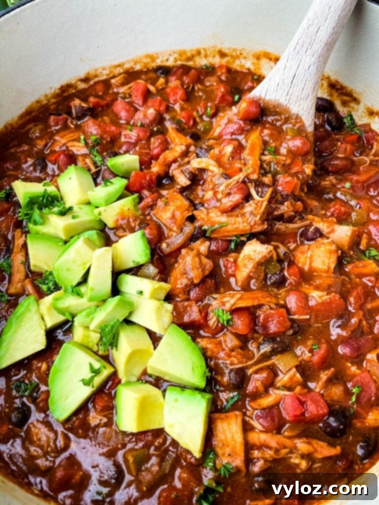 leftover turkey chili in a purple Dutch oven