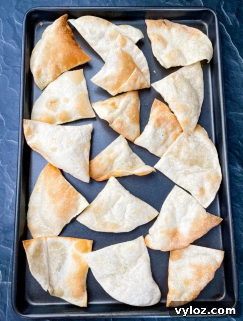 Reinvented Turkey Nachos 5 tortilla chips on a sheet pan