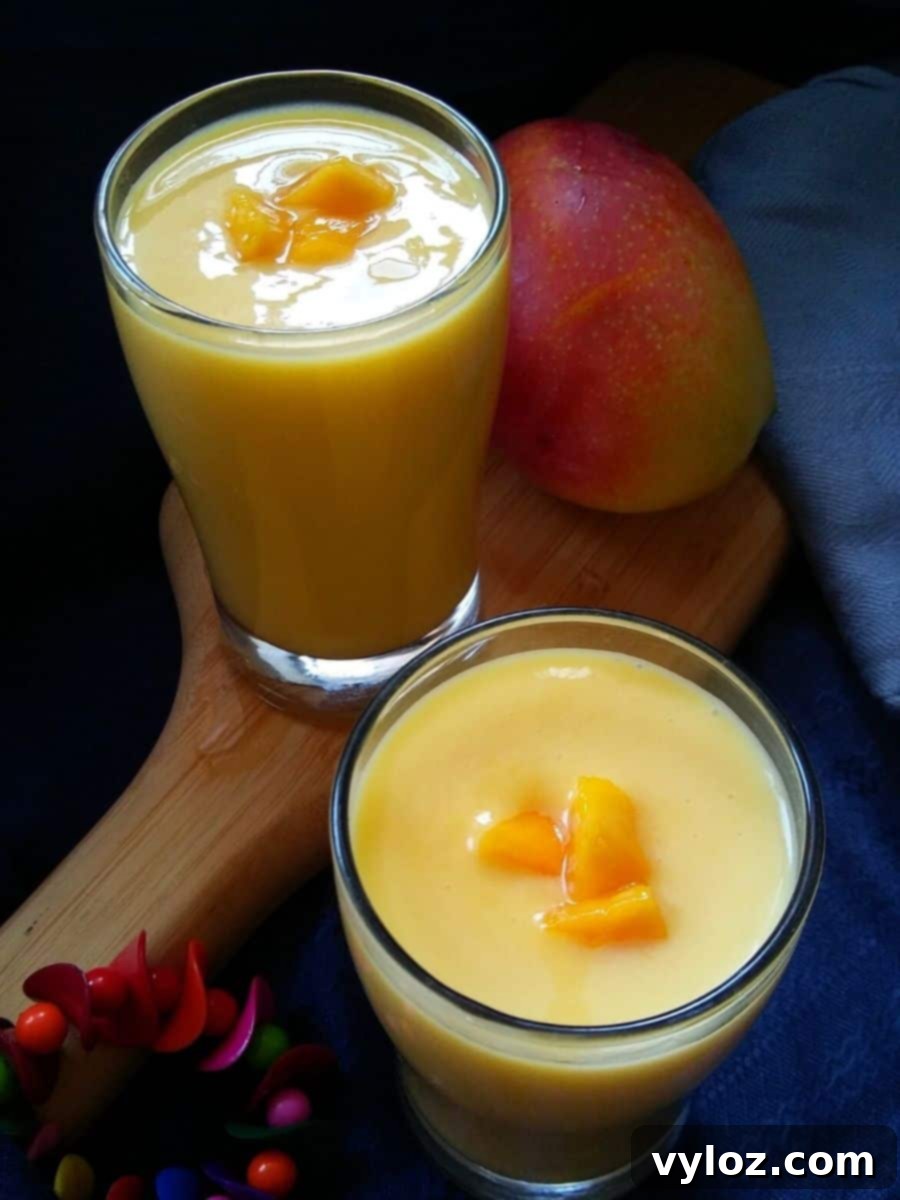 Mango milkshake served in two glasses