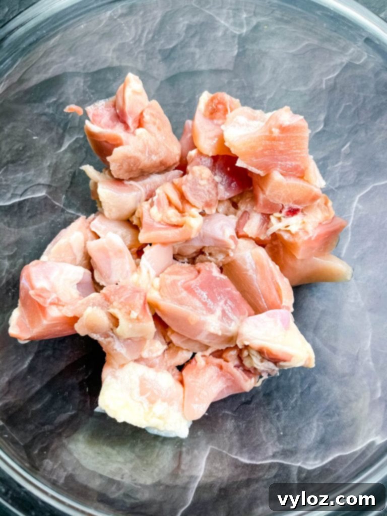 raw chicken thighs in a glass bowl