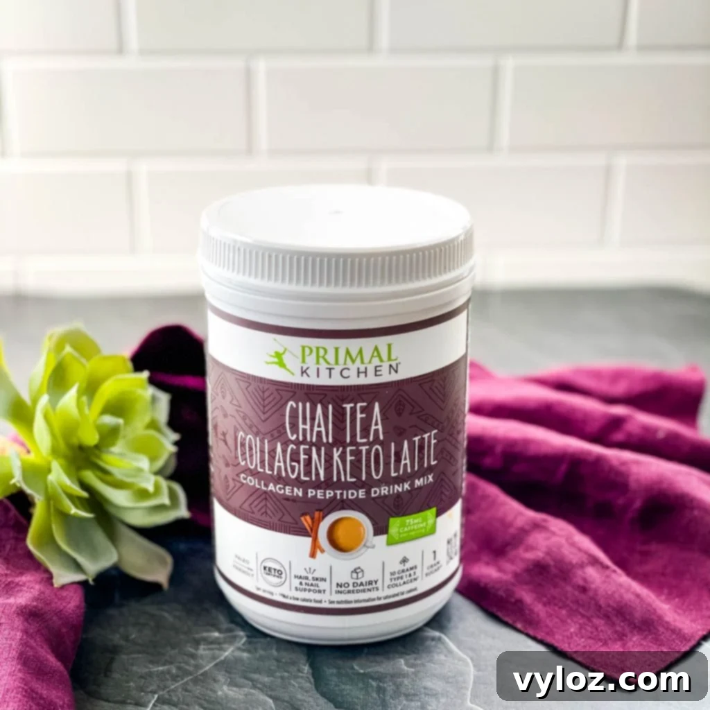 Primal Kitchen Chai Collagen powder displayed on a flat surface, highlighting its natural ingredients.
