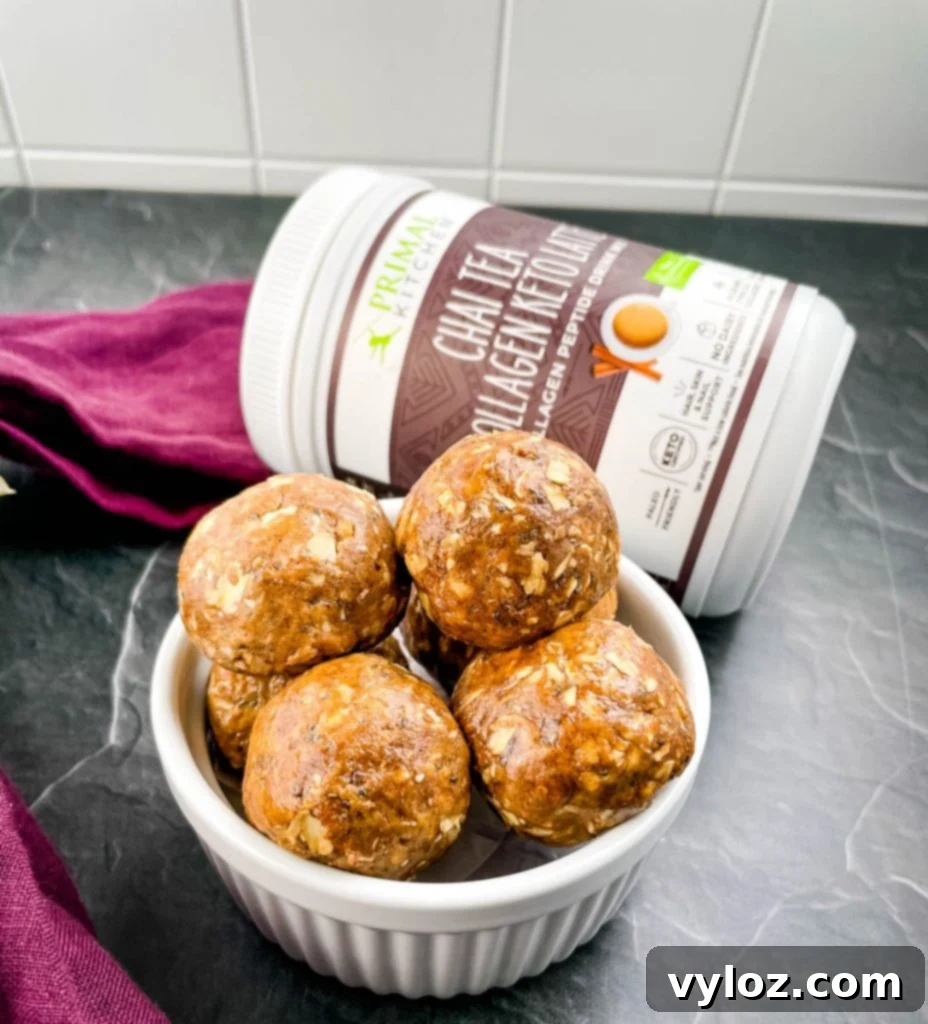 A bowl filled with freshly prepared Chai Almond Butter Protein Balls, ready to be stored or served.