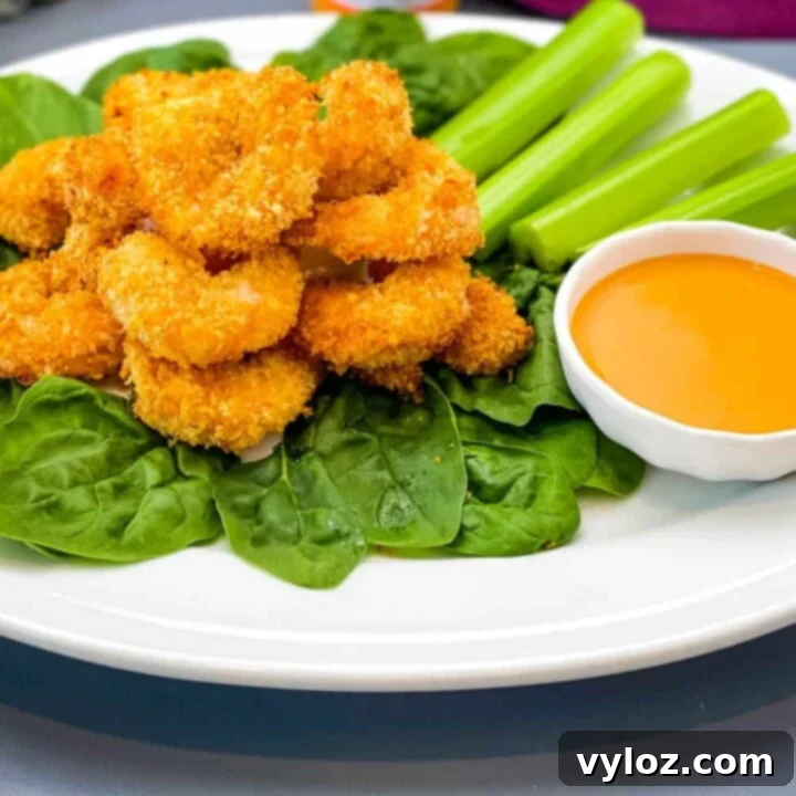 30 Quick and Delicious Air Fryer Appetizers 20 Spicy buffalo shrimp served in a bowl, perfect for an appetizer.