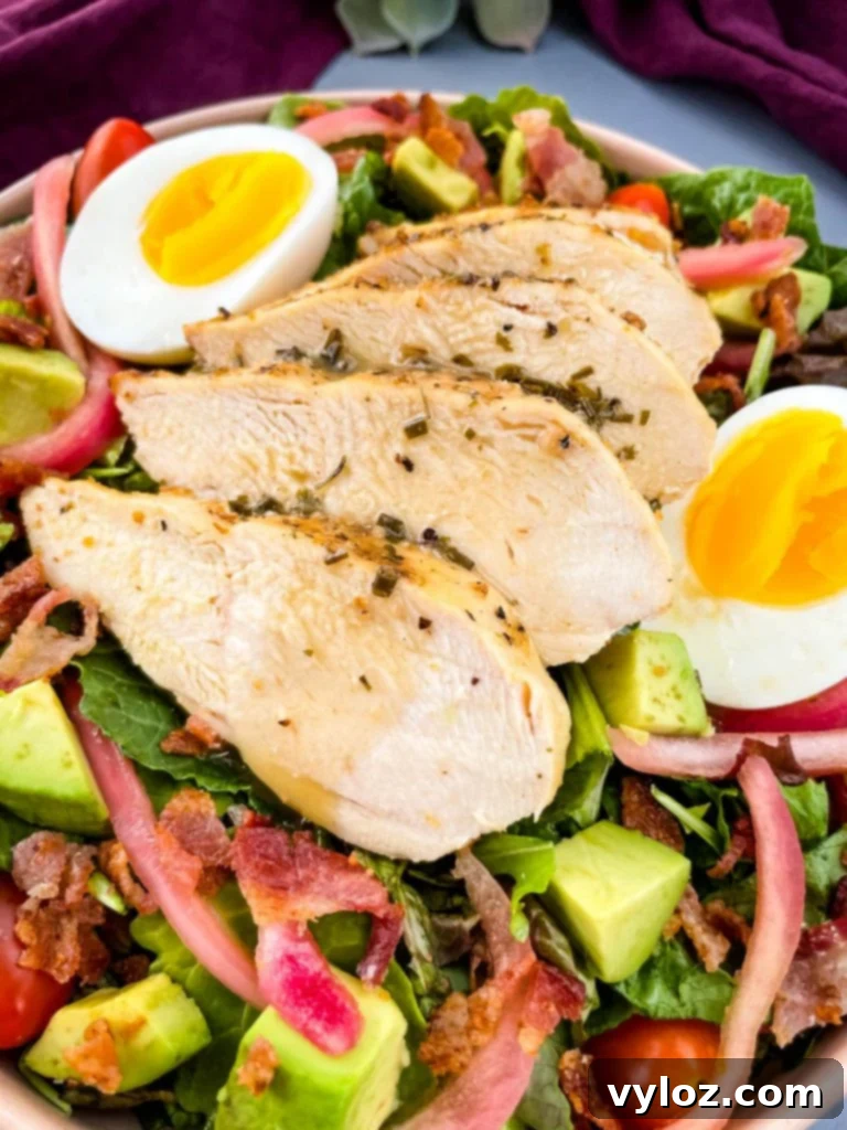 Close-up of a vibrant Green Goddess Cobb Salad in a bowl