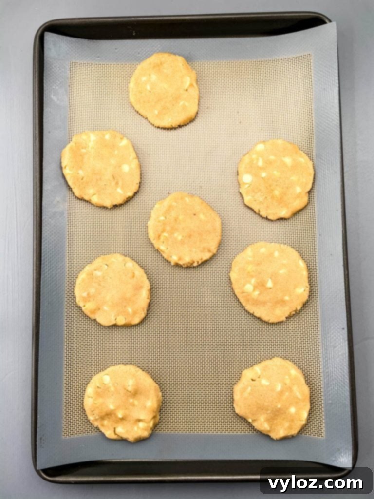 unbaked keto macadamia nut cookies on a cookie sheet
