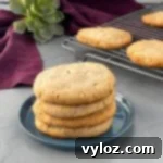 keto macadamia nut cookies stacked on a plate