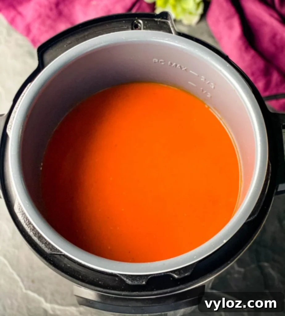 Instant Pot filled with creamy tomato soup