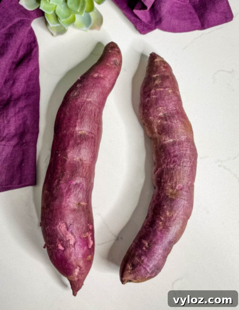 raw Stokes purple sweet potato on a flat surface