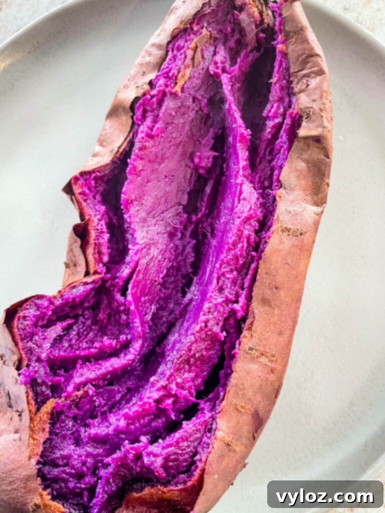 Stokes purple sweet potato fully cooked and sliced open on a plate