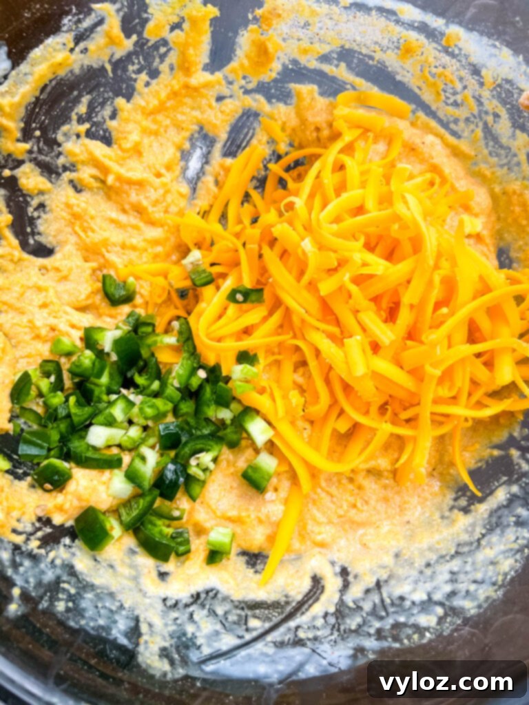 batter for hushpuppies with shredded cheddar and chopped jalapenos