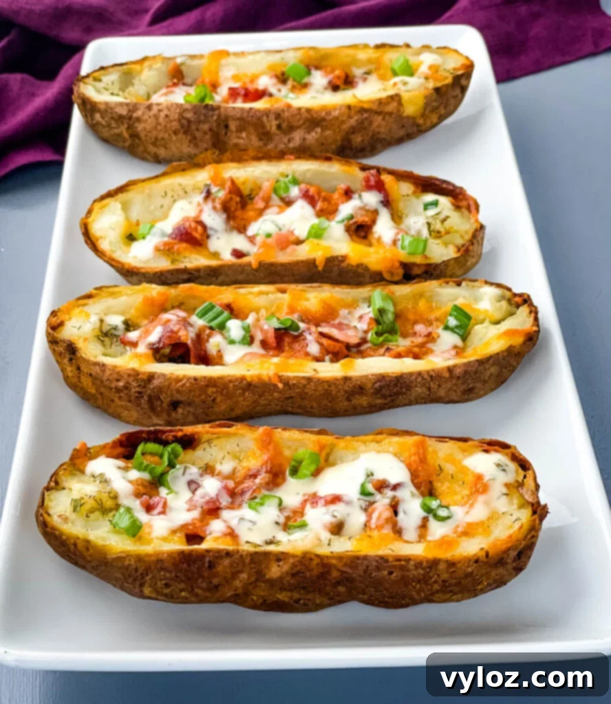 Crispy Air Fryer Potato Skins with bacon, cheddar, and ranch drizzle