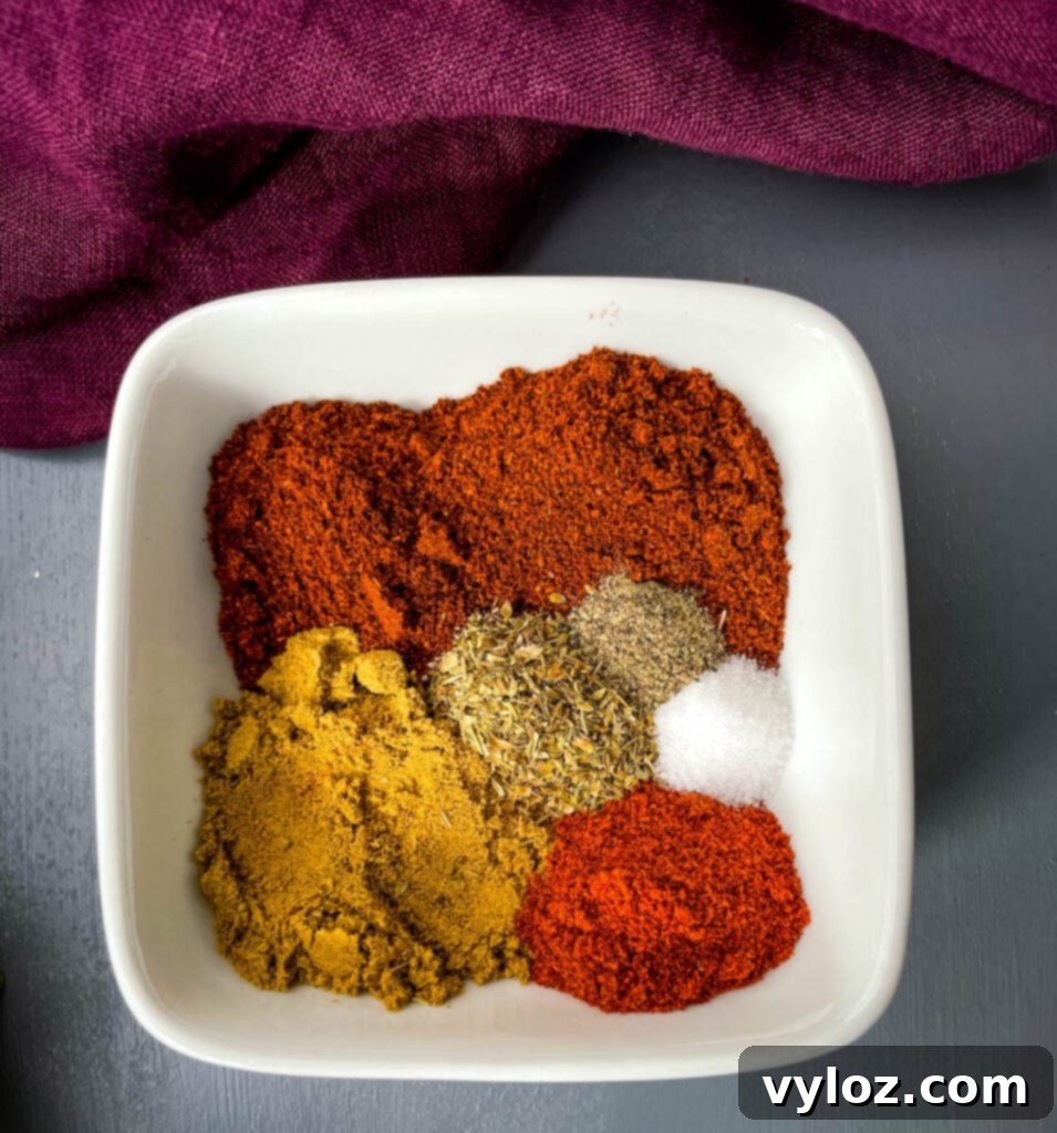 DIY Chili Spice Blend 3 A closer look at homemade chili seasoning in a white bowl, showcasing its rich color and texture.