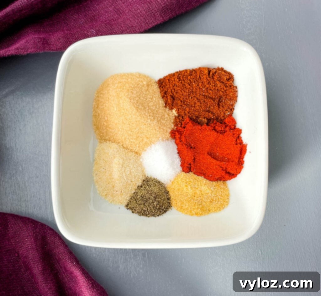 Homemade BBQ seasoning in a white bowl, ready to be used