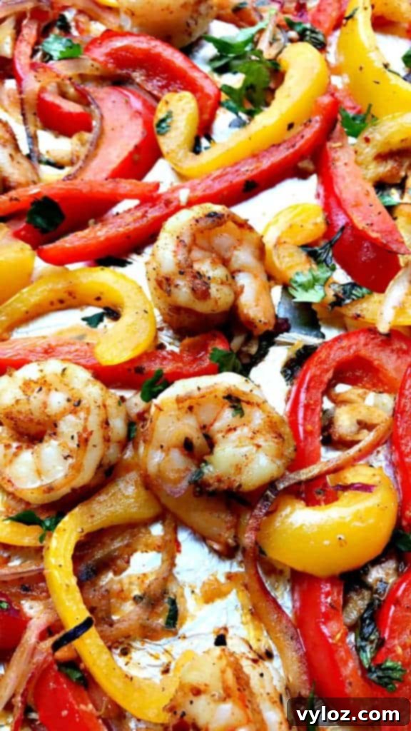 Effortless 20-Minute Low-Carb Sheet Pan Shrimp Fajitas 5 Serving of 20-Minute Low-Carb One Sheet Pan Shrimp Fajitas with a side of guacamole