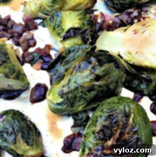 Roasted Brussels sprouts on a foil-lined baking sheet, golden brown and delicious