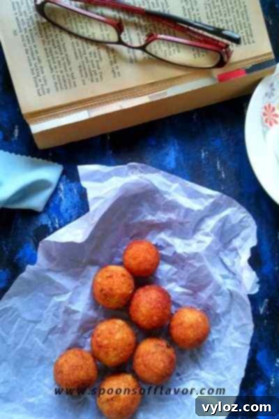 Crispy Paneer Potato Balls served on a platter, garnished with fresh cilantro.